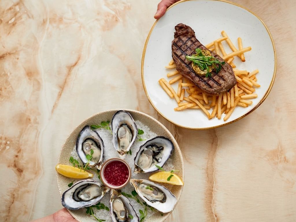 Oysters and steak dish at Sebel Quay West Suites Sydney