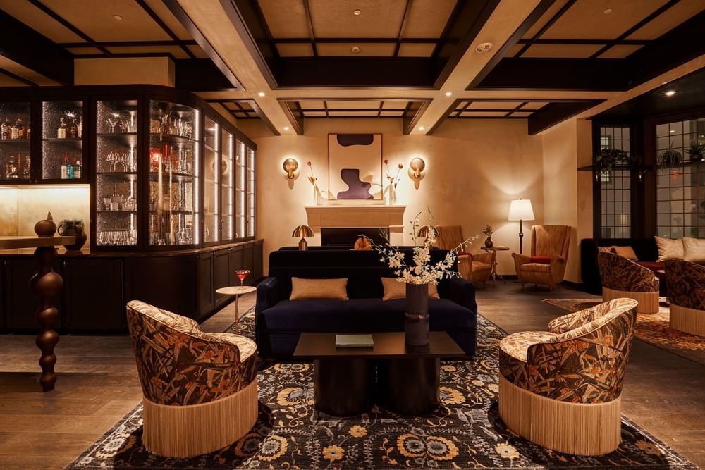 Chic lounge space with upscale decor and a sleek bar at El Prado Hotel 