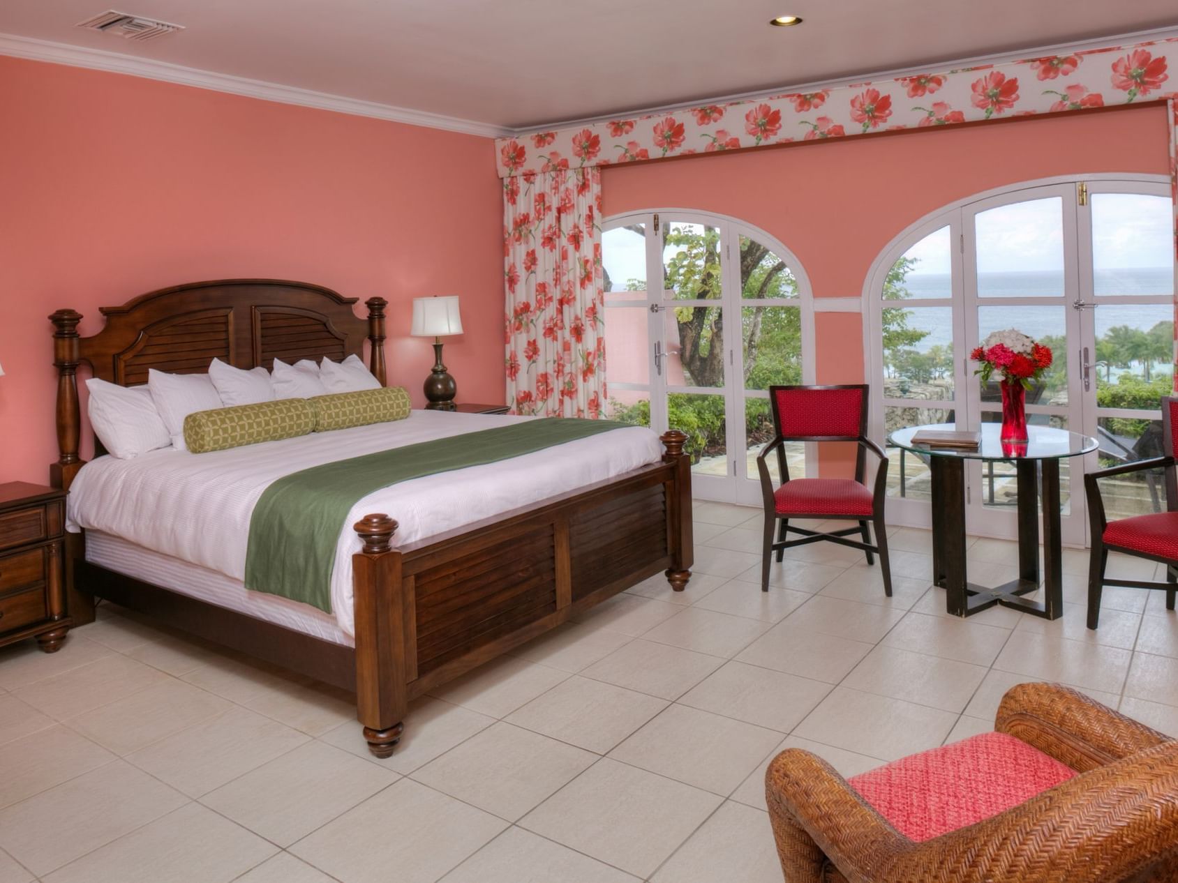 Bed & lounge area in Luxury Ocean View Room at The Buccaneer
