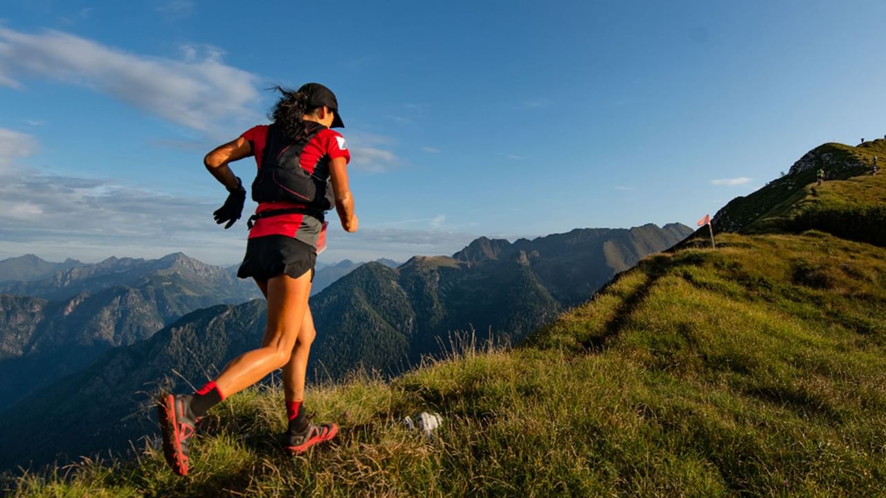 runner on along a mountain ridge