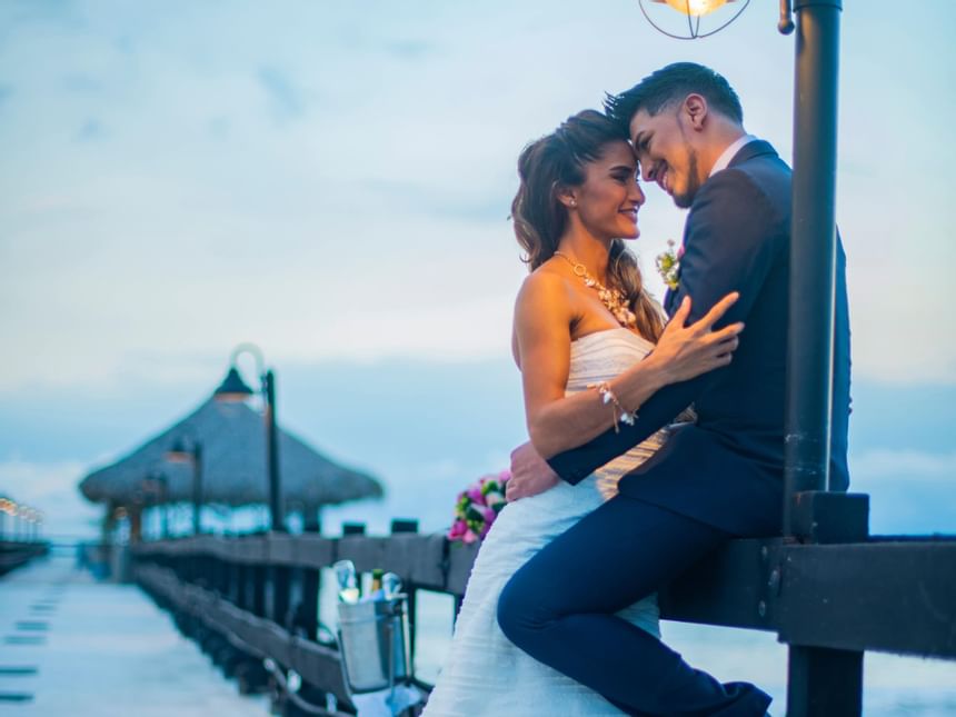 A couple hugging during a photoshoot at Fiesta Resort