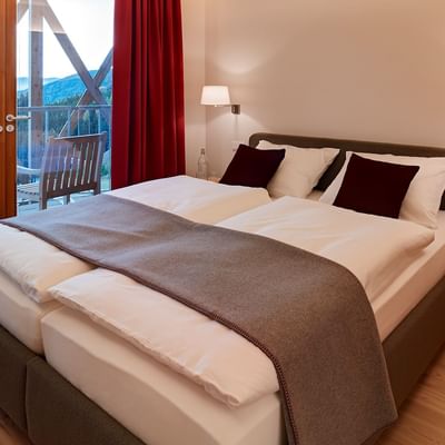 Twin beds in Residence Comfort at Falkensteiner Hotels