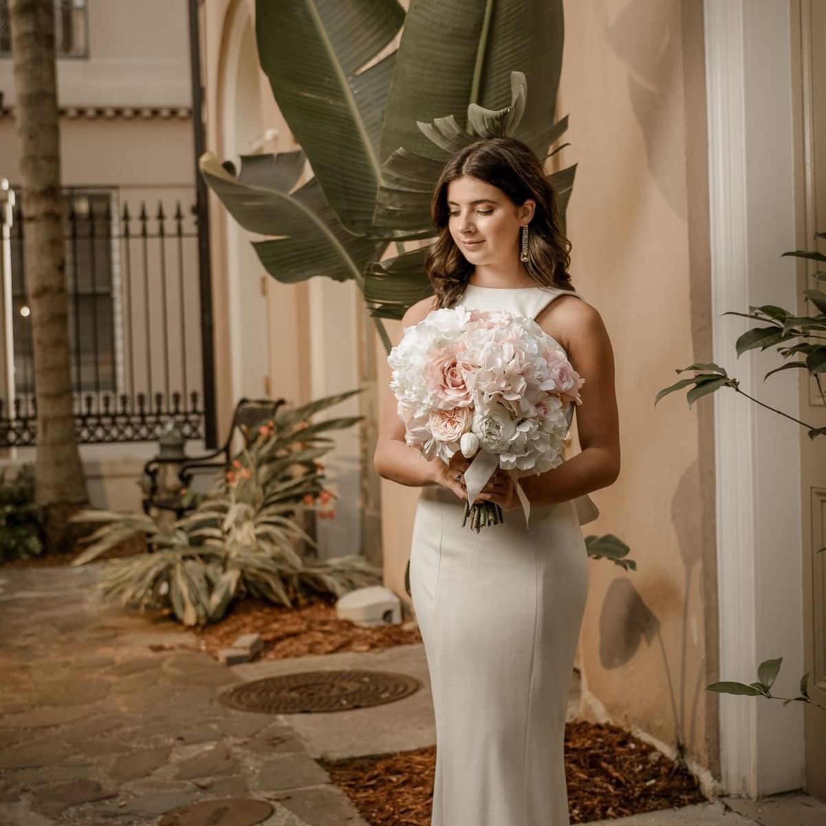A bride posing for a photo at St. James Hotel