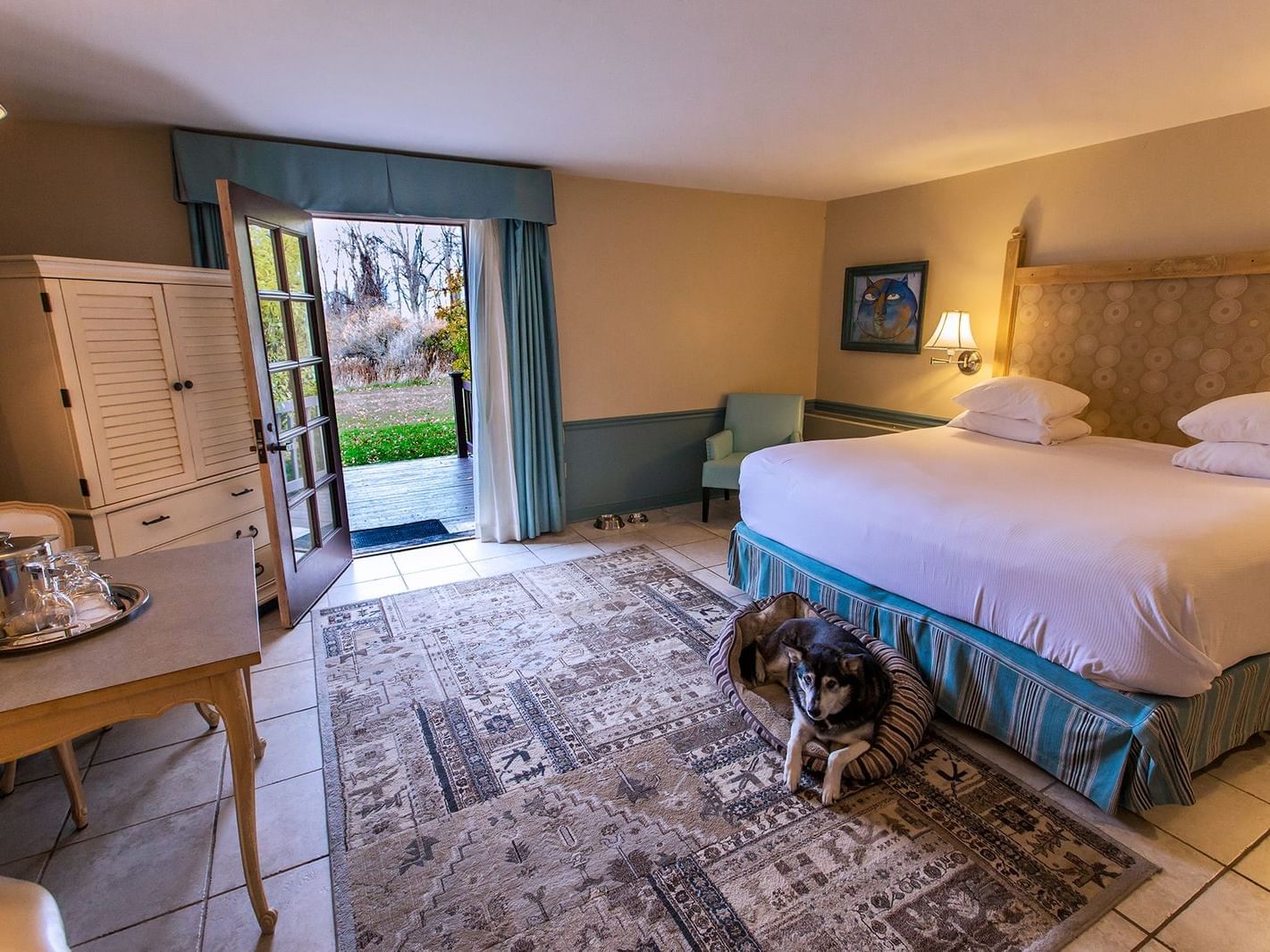 A dog in Traditional Pet-Friendly King Room at La Tourelle Hotel and Spa