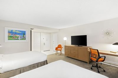 Bed with TV area in Queen Bedroom at The Anaheim Hotel