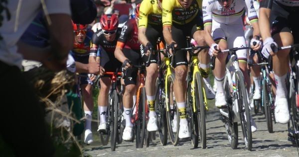 Group of road cyclists racing together on a sealed road during a New Zealand cycling road event