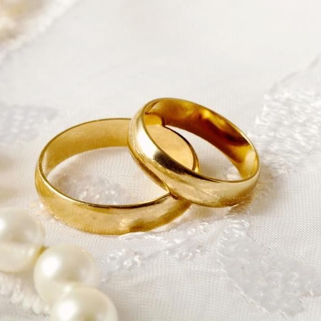 Pair of two traditional yellow gold wedding rings featuring our article on 