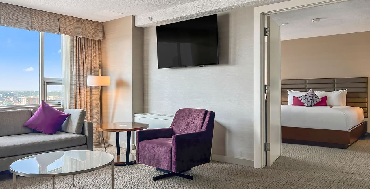 Living area and bedroom of a hotel suite