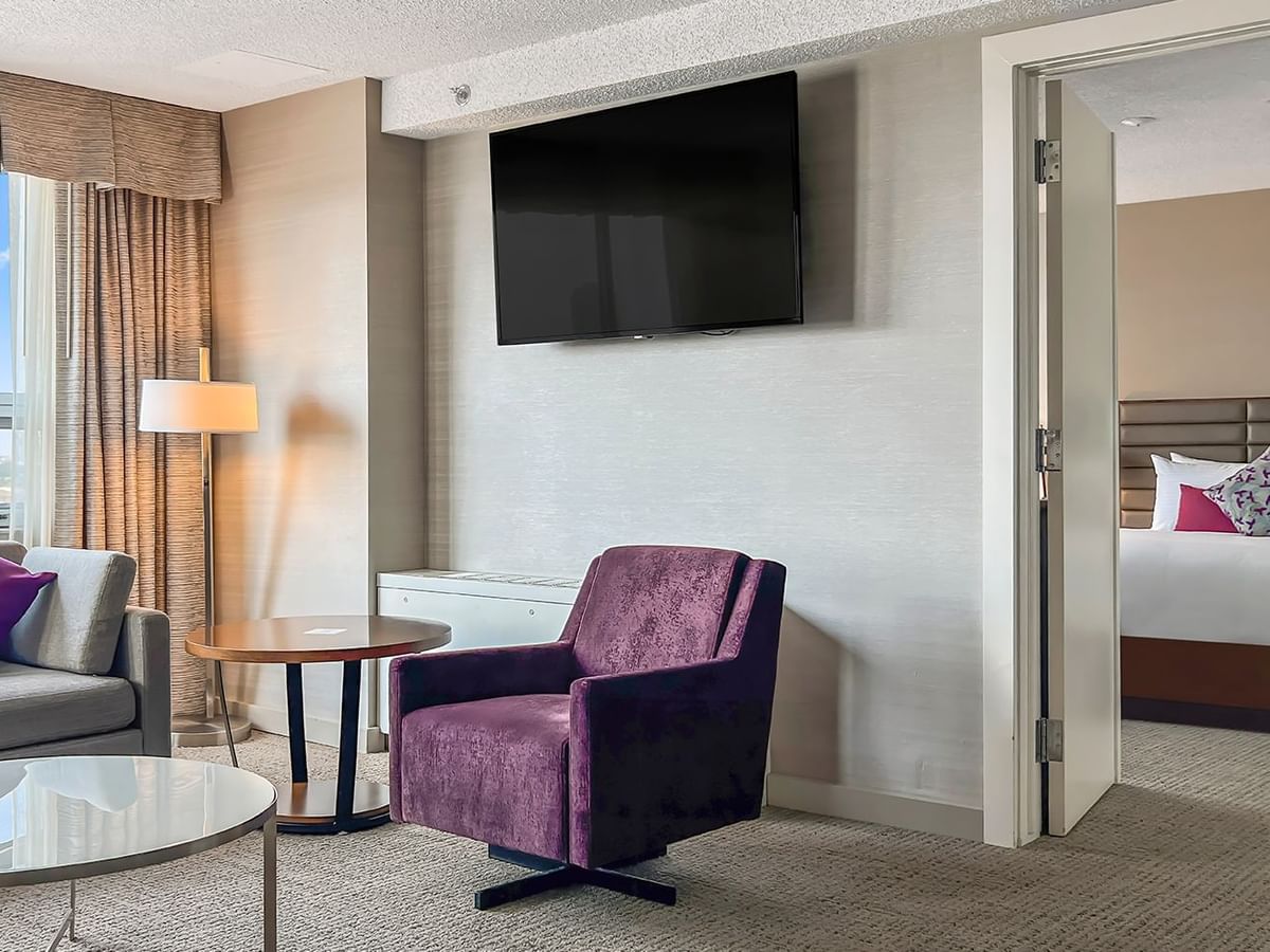 Living area and bedroom in a hotel suite