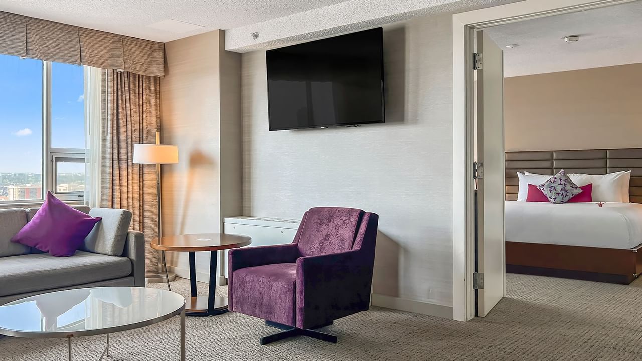 Living area and bedroom in a hotel suite