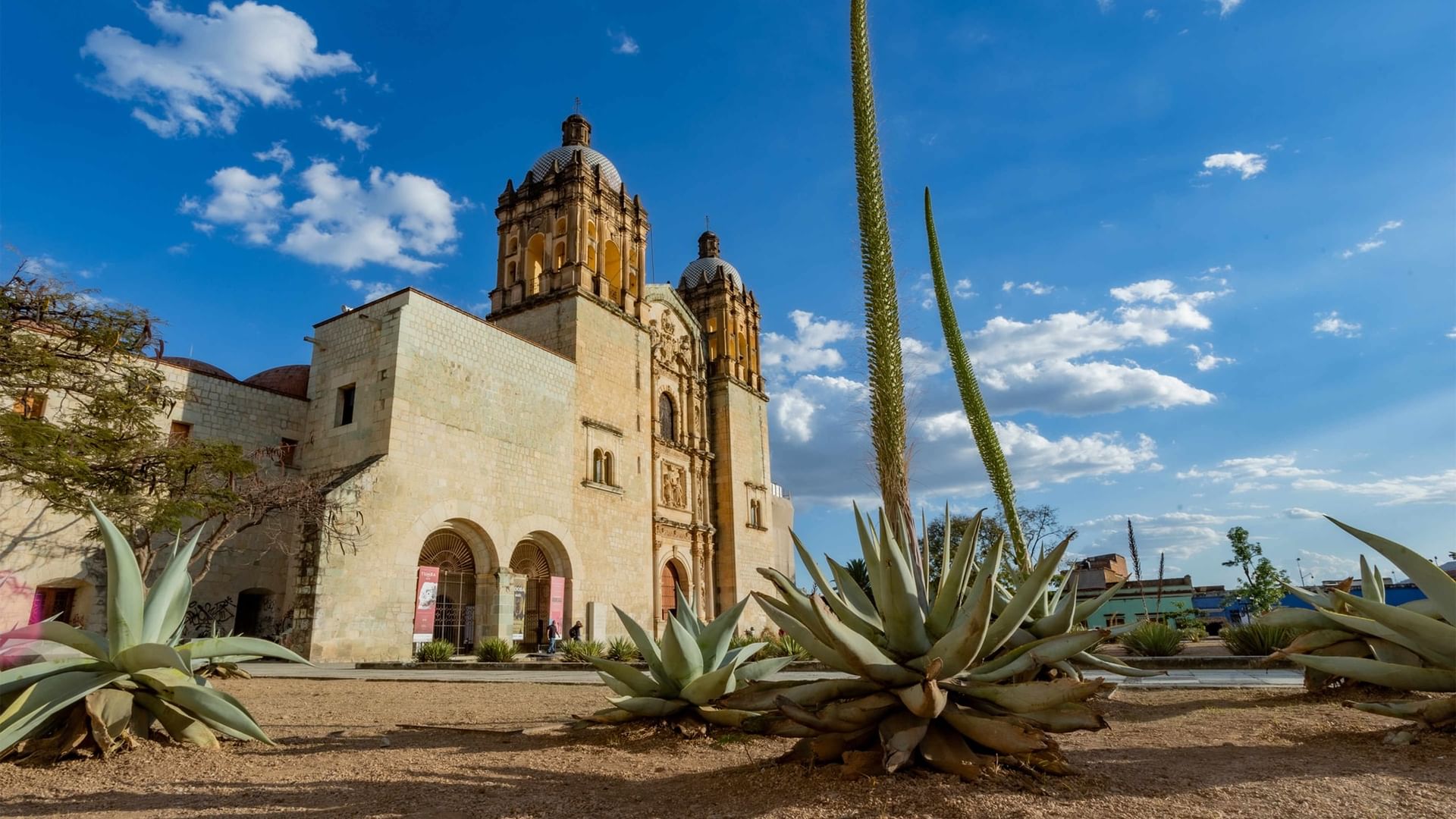 Church of Santo Domingo de Guzmán under a blue sky near Quinta Real
