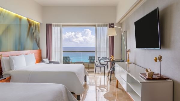Beds & TV in Premium Ocean Front 1 Double at Live Aqua Resorts