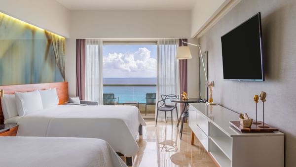 Twin beds & TV in Premium Ocean Front at Live Aqua Resorts