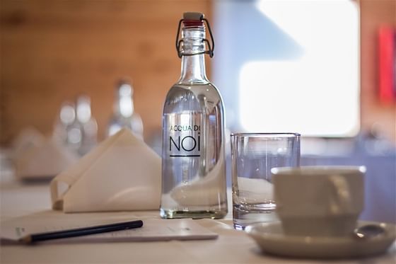 close up of glass NOI Water bottle at NOI Puma Lodge Hotel