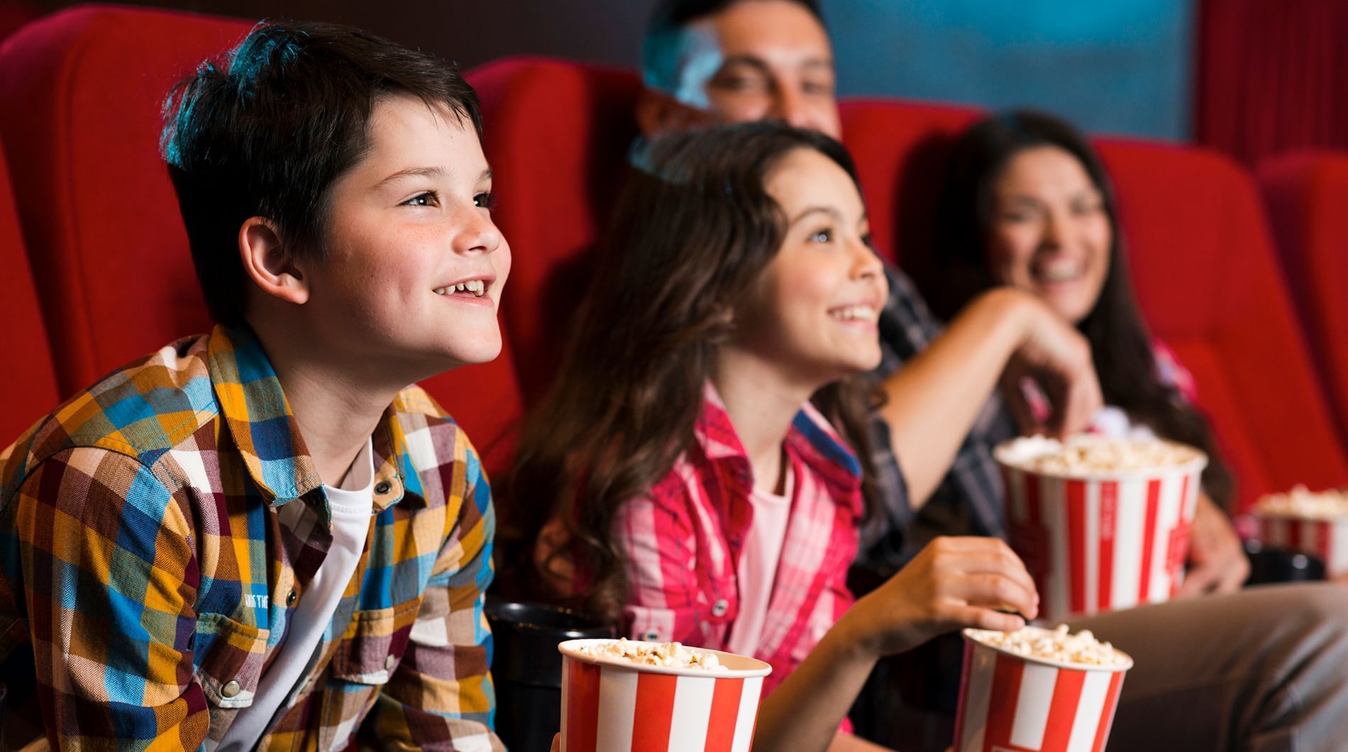 A family enjoying a movie at a cinema near Sunway Lagoon Hotel