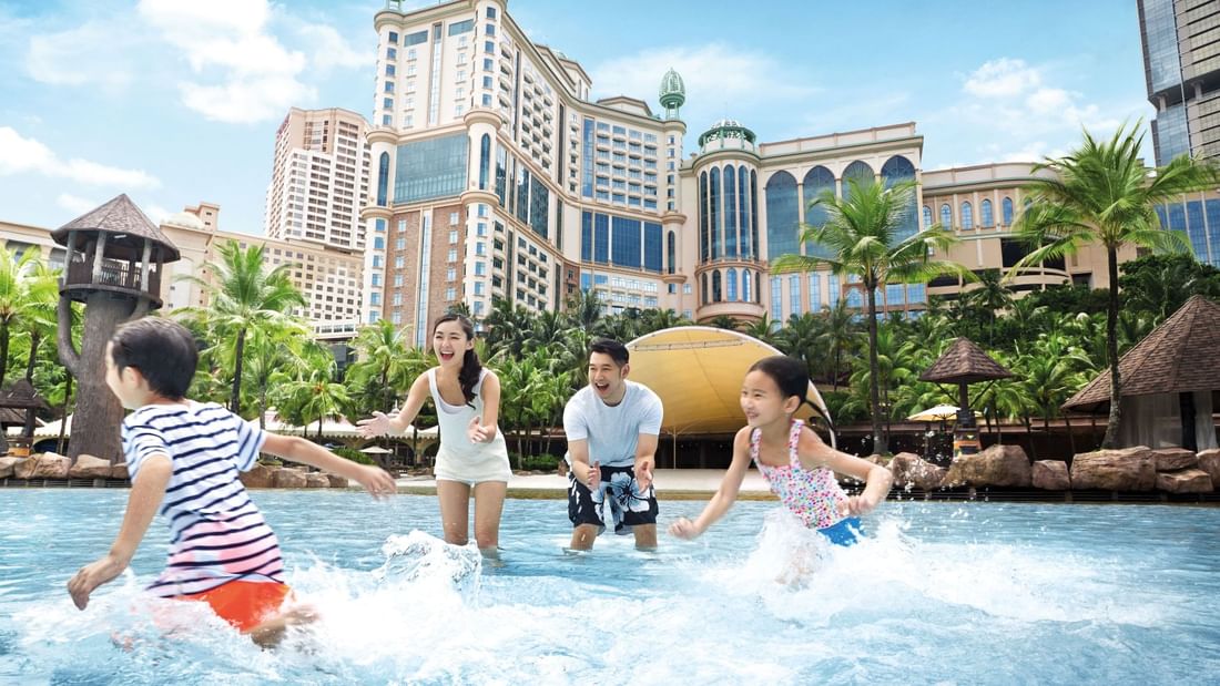 Family playing in the outdoor pool featuring the Funtastic Family Getaway at Sunway Lagoon Hotel