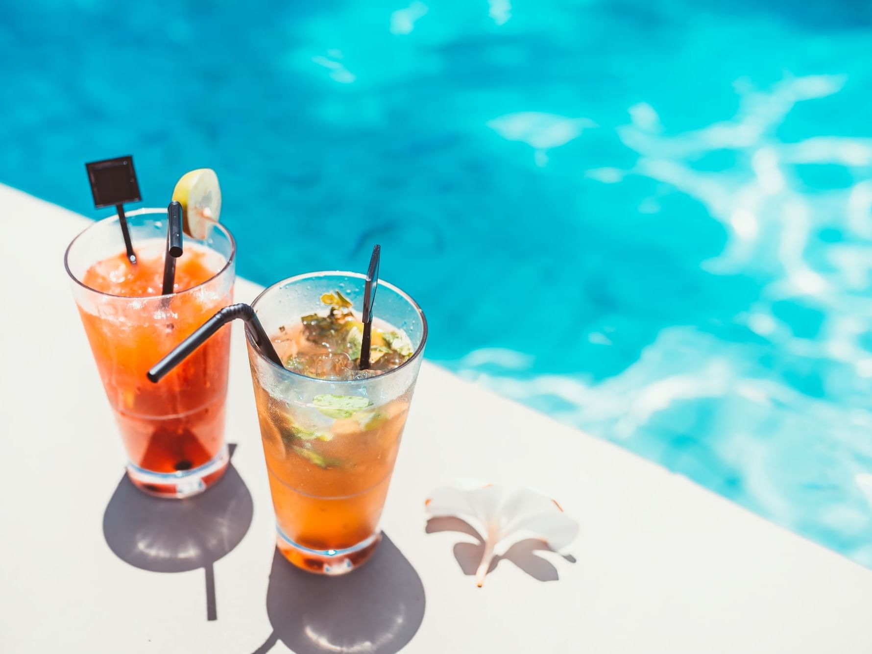 Two cocktails served by the pool edge, at Grand Coloane Resort