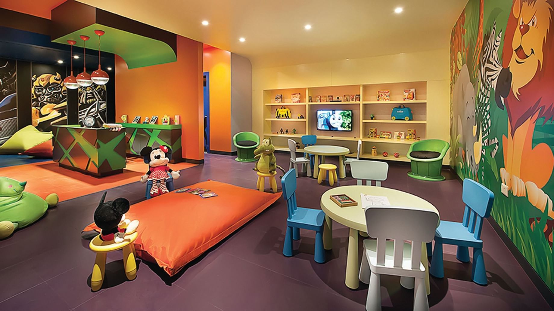 Vibrant children's play area with colorful furniture at DAMAC Maison Cour Jardin