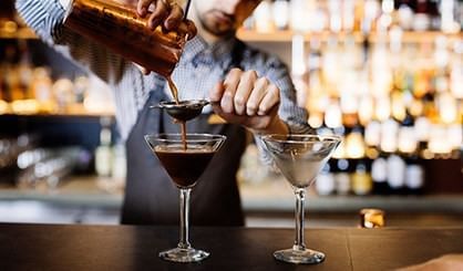 Closeup of pouring cocktail to a glass at Freycinet Lodge