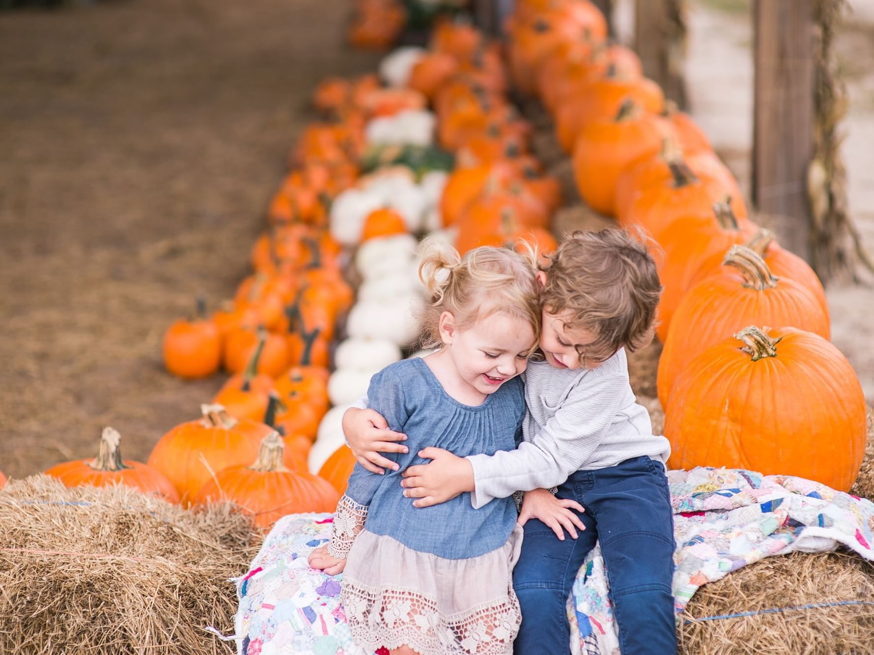 Two kids hugging at Southern Hill Farms near Lake Buena Vista Resort Village & Spa