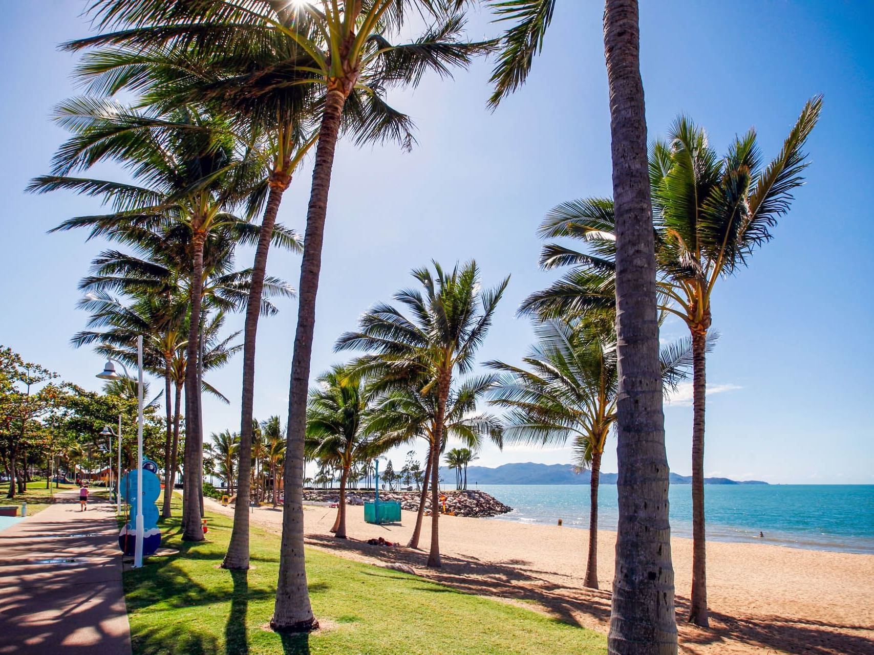 Palm trees, walking path & beach view in The Strand Park near Hotel Grand Chancellor Townsville
