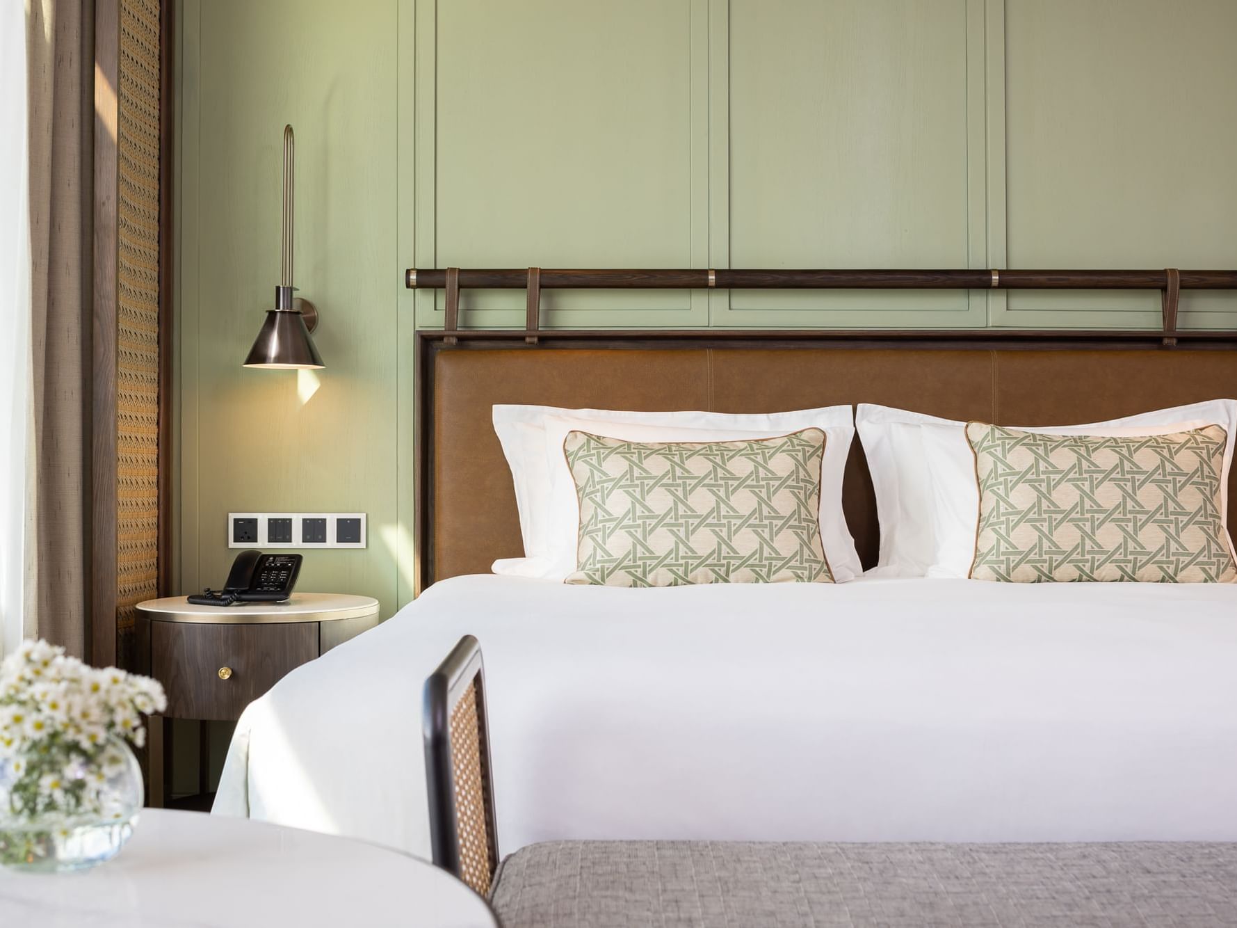 Lamp by the King bed with comfy pillows in One bedroom suite at Eastin Grand Hotel Phayathai