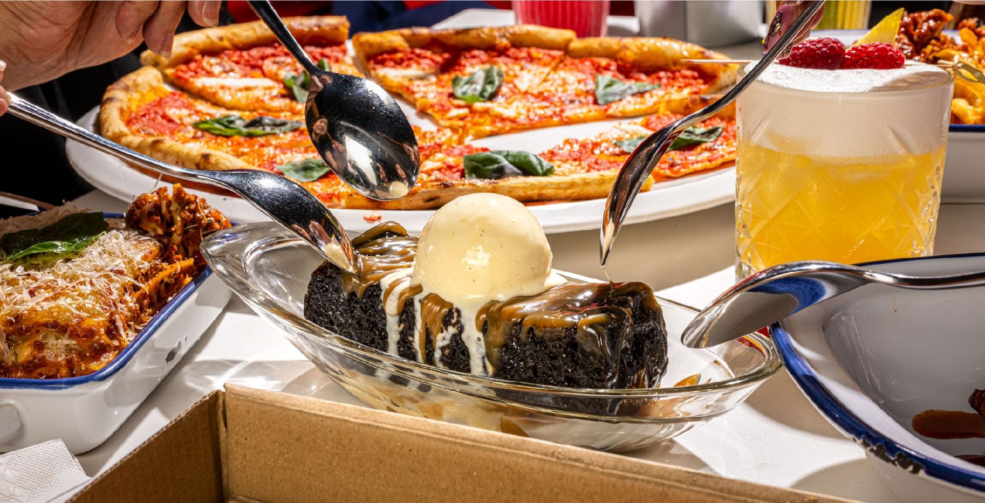 Chocolate brownie with ice cream and caramel, with pizzas served in Gordon Ramsay Street Pizza at Sunway Resort