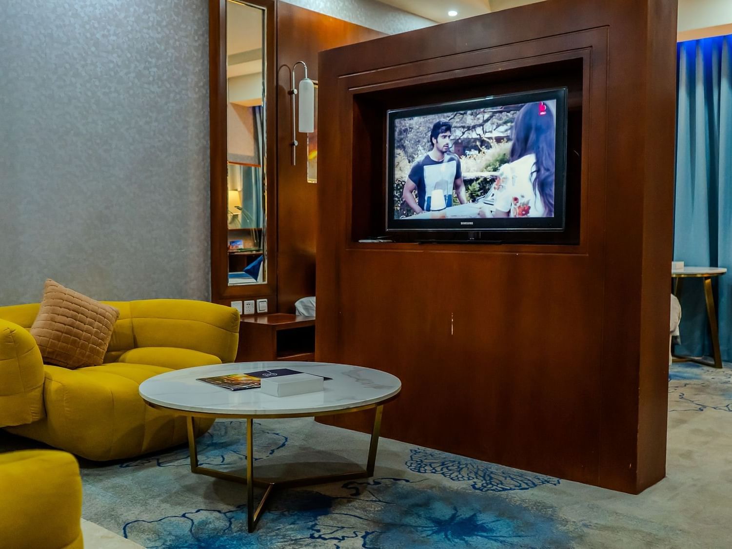 Living area with plush seatings and TV in Superior Family Room at Dabab Hotel by Warwick - Riyadh