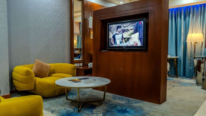 Living area with plush seatings and TV in Superior Family Room at Dabab Hotel by Warwick - Riyadh