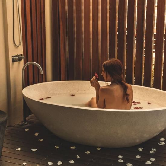 Lady in a bathtub at Vie Spa in Pullman Cairns