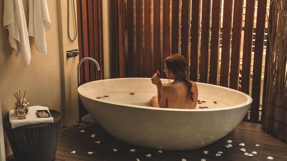 Lady in a bathtub at Vie Spa in Pullman Cairns
