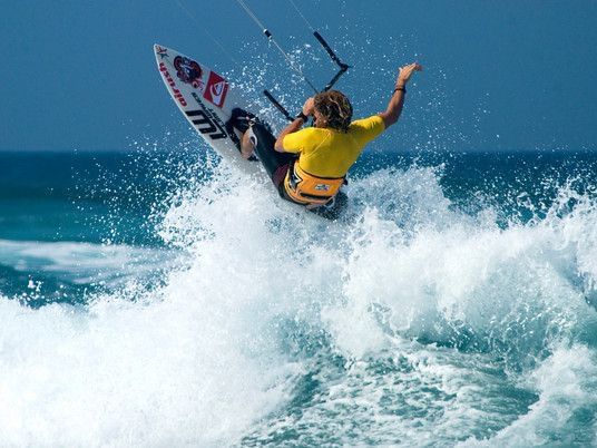 A man Kite surfing at the beach near Gran Ventana Beach Resort