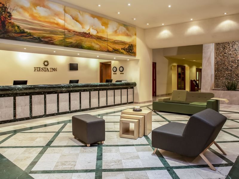 Reception Counter & seating area in a Lobby at Fiesta Inn