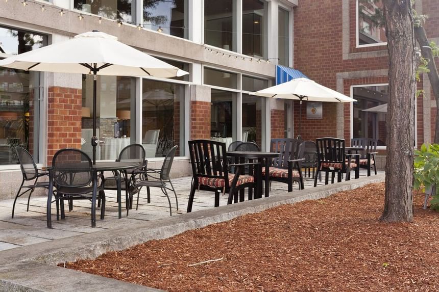 Exterior view of the outdoor dining area at UMass Lowell Inn