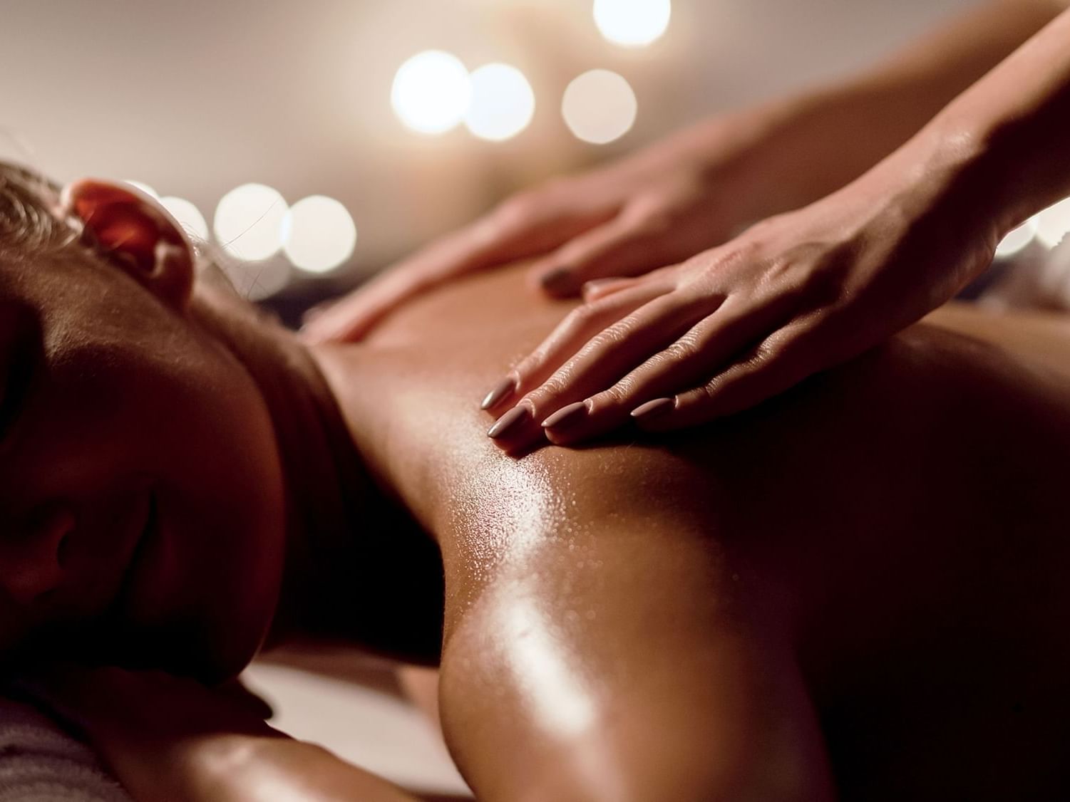 Person receiving a soothing massage at the tranquil spa of Paramount Hotel Midtown
