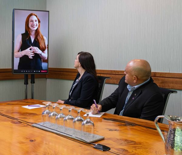 A women presenting virtually during a meeting