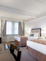 TV facing bed near window in Premier City View 2 Double Beds with Terrace at Warwick New York