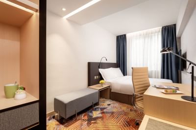 Lounge & work desk by the bed in Superior Single Room at Park Hotel Hong Kong