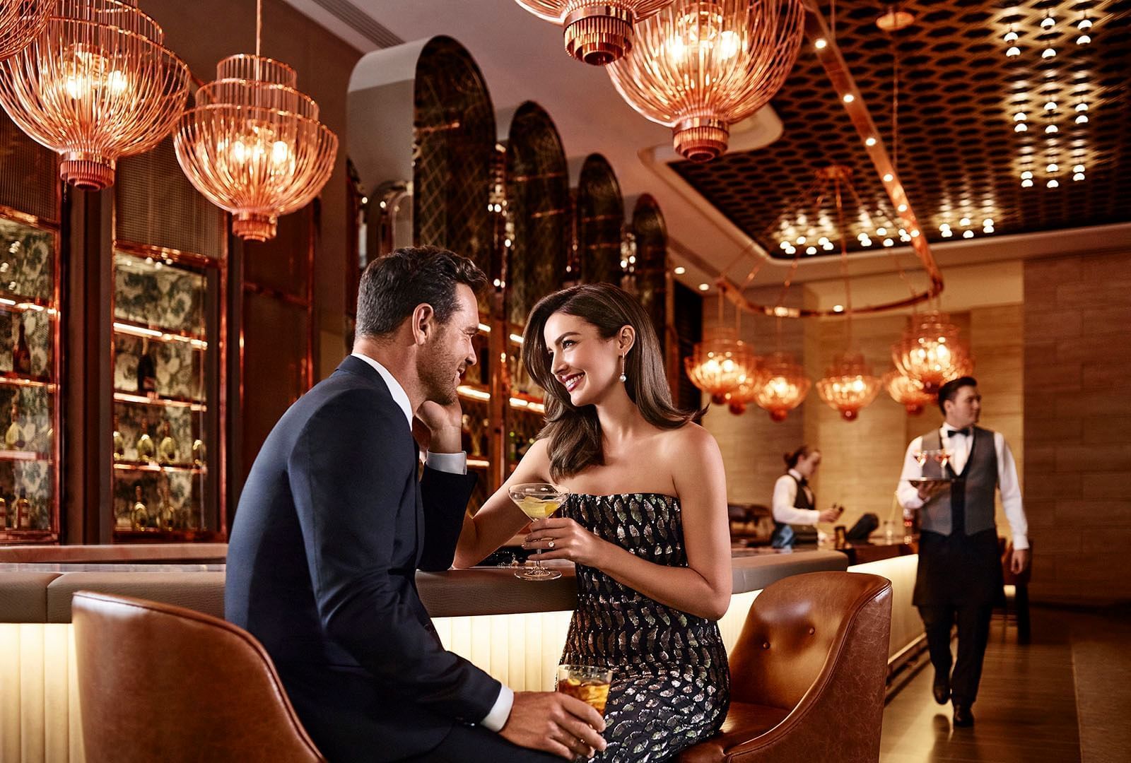 Couple hanging out in the bar at Crown Hotels