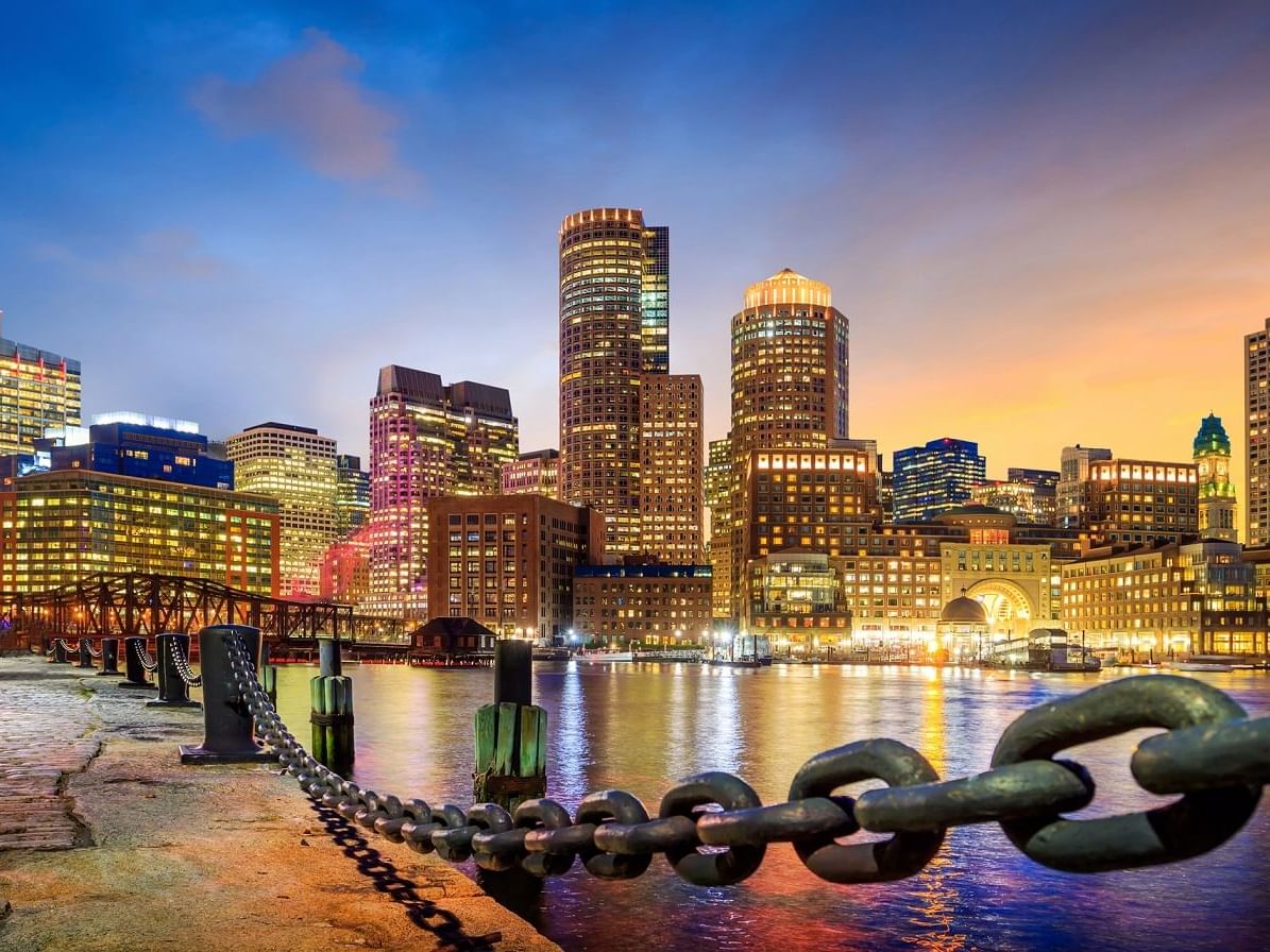 Boston Harbor with skyline near The Godfrey Boston Hotel