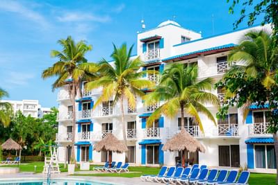 Sunbeds by the outdoor pool at Playa Blanca Beach Resort