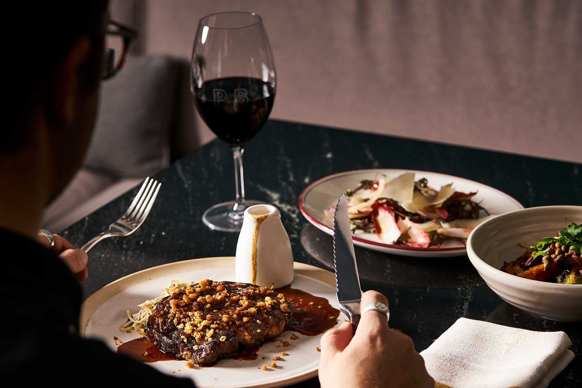 Dishes & wine served in restaurant at Melbourne Central Hotels