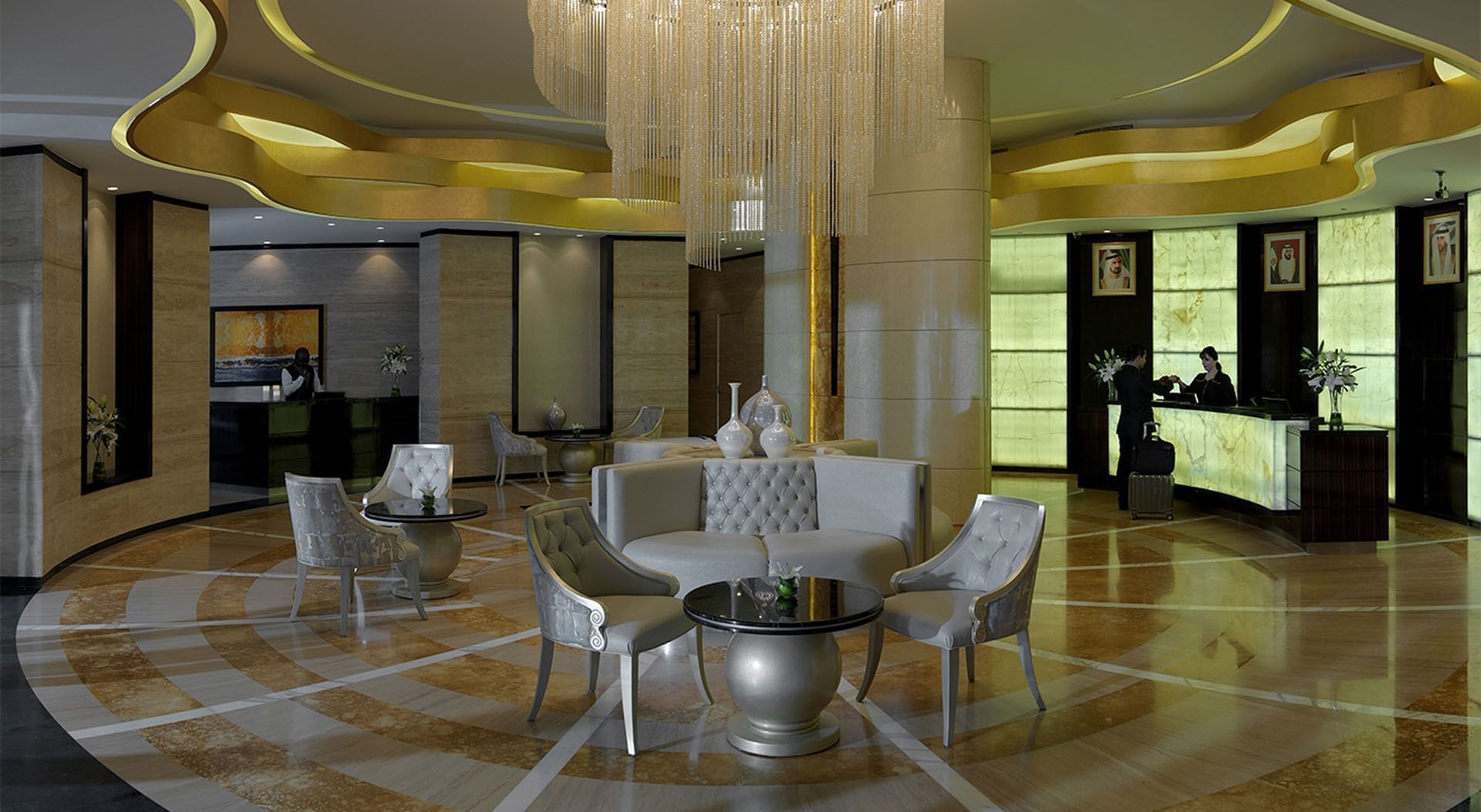 Elegant lobby with modern seating, intricate lighting, and reception desk at DAMAC Maison Cour Jardin Dubai