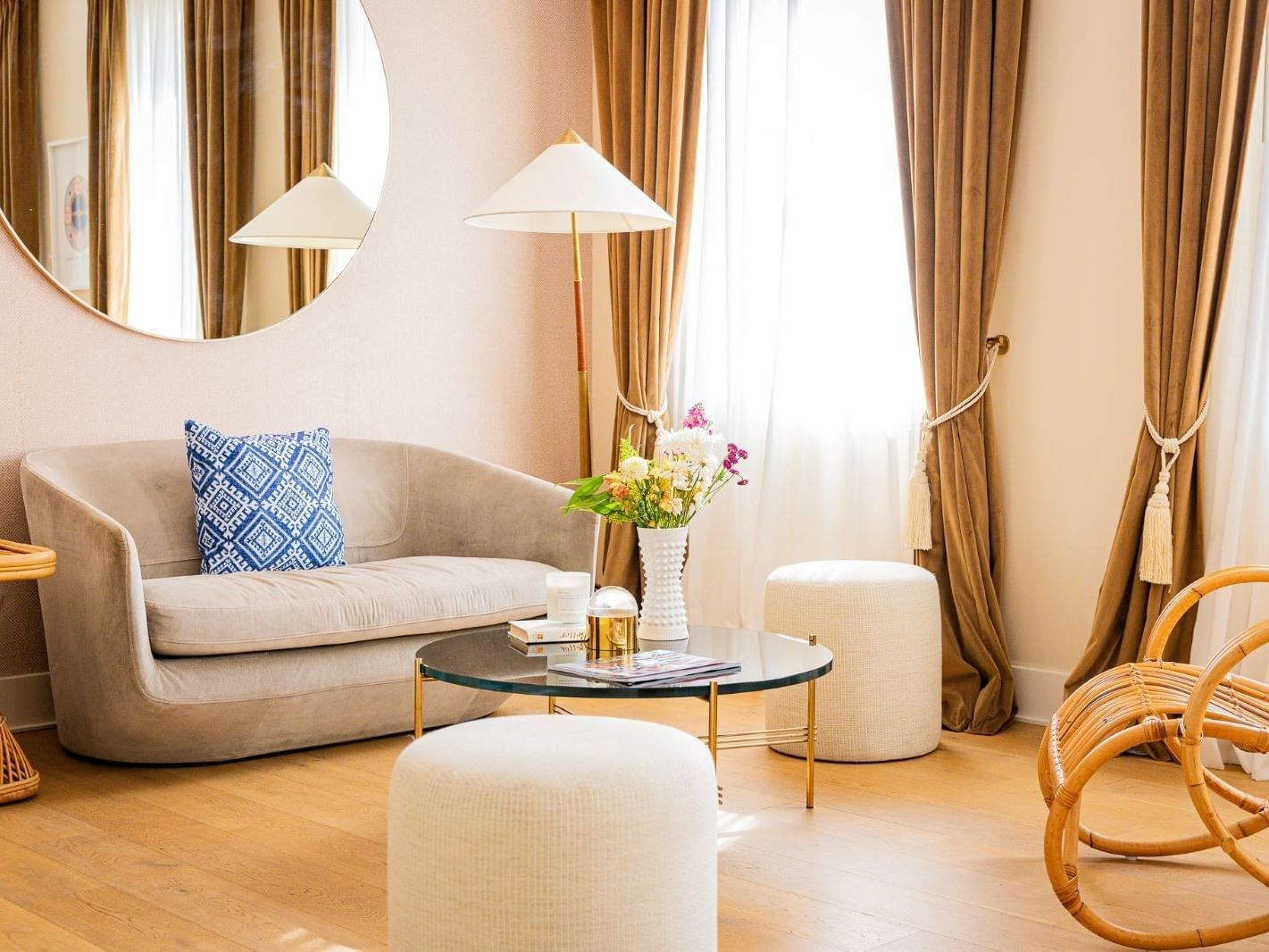 Living area with wooden floors in Grand One Bedroom King Suite with Balcony at The Savoy Hotel & Beach Club