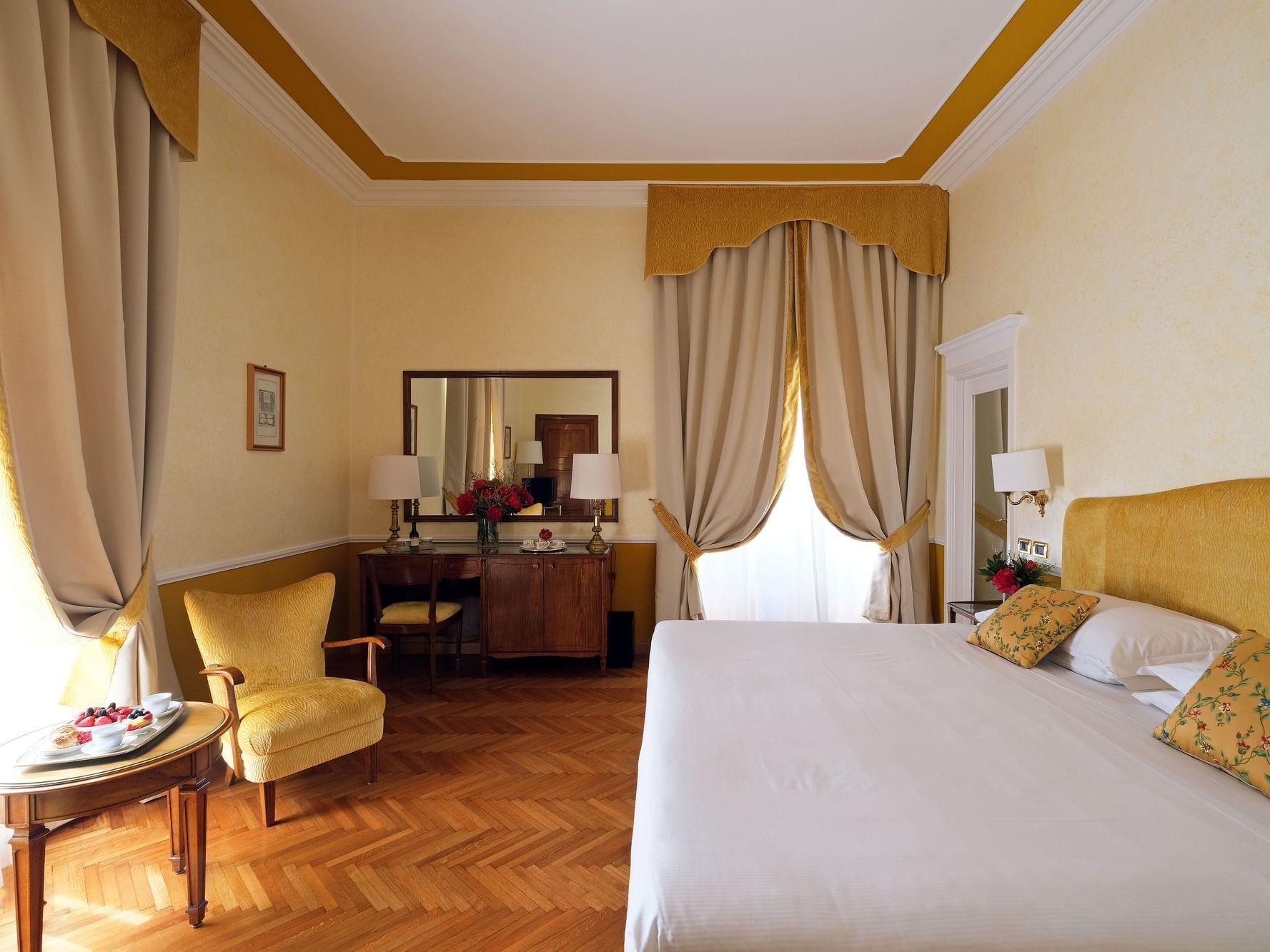 Cozy bed, Mirror and coffee table in Suites at Bettoja Hotel Mediterraneo