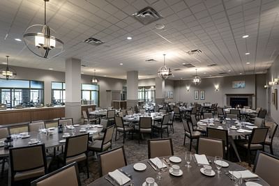 Asger\'s Dining Room with setup tables under contemporary spherical pendant lighting at Spencer Hotel & Conference Centre