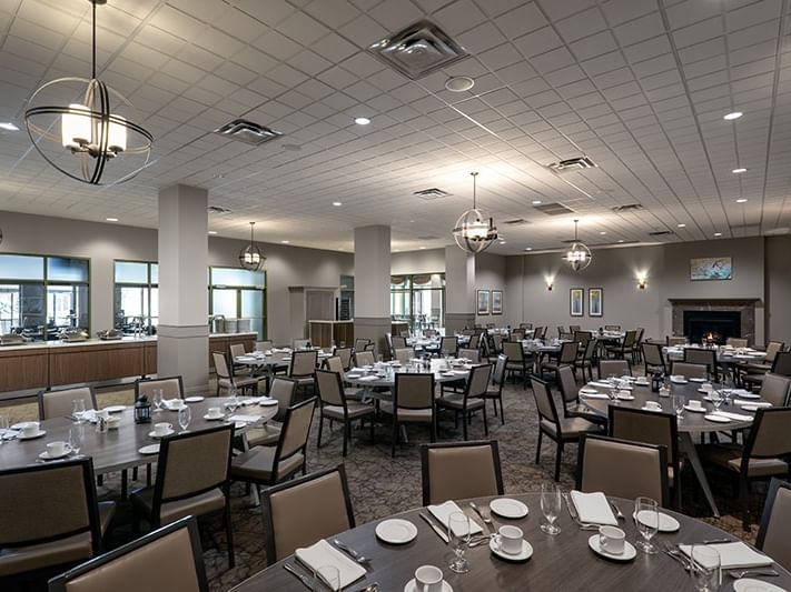 Asger\'s Dining Room with setup tables under contemporary spherical pendant lighting at Spencer Hotel & Conference Centre