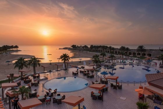 Two pools with dining area at Mena Holiday beach Resort