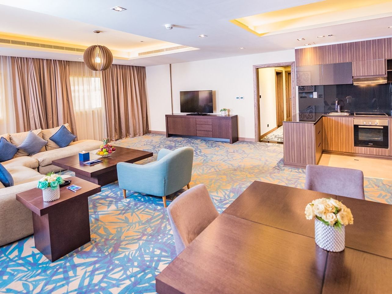 TV & Living area of Executive suite at Mena Plaza Hotel