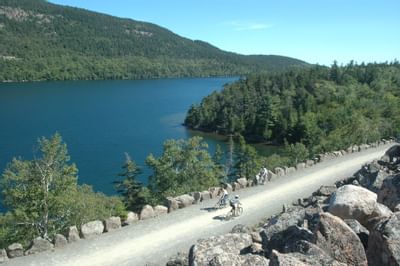 couple biking near lake